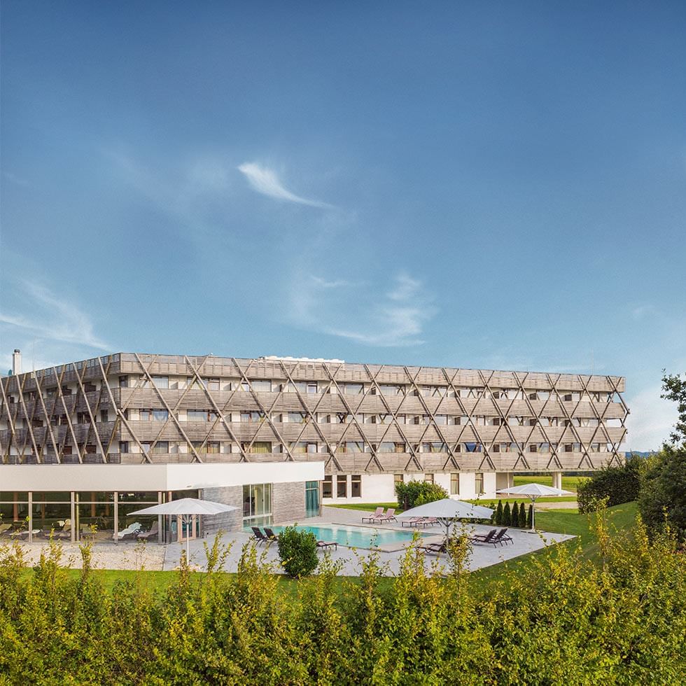 Distance exterior of the hotel building with lawn at Falkensteiner Genuss & Wohlfühlhotel Mühlviertel