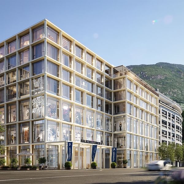 Exterior view of Falkensteiner Hotel Bozen with mountain backdrop