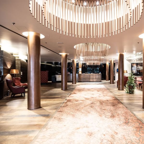 Front desk by lobby lounge area at Falkensteiner Hotel Bratislava