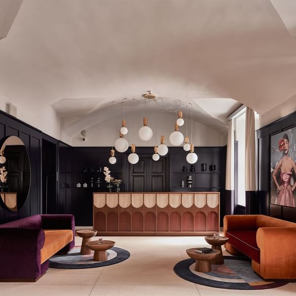 Front desk by lobby lounge area at Falkensteiner Hotel Prague