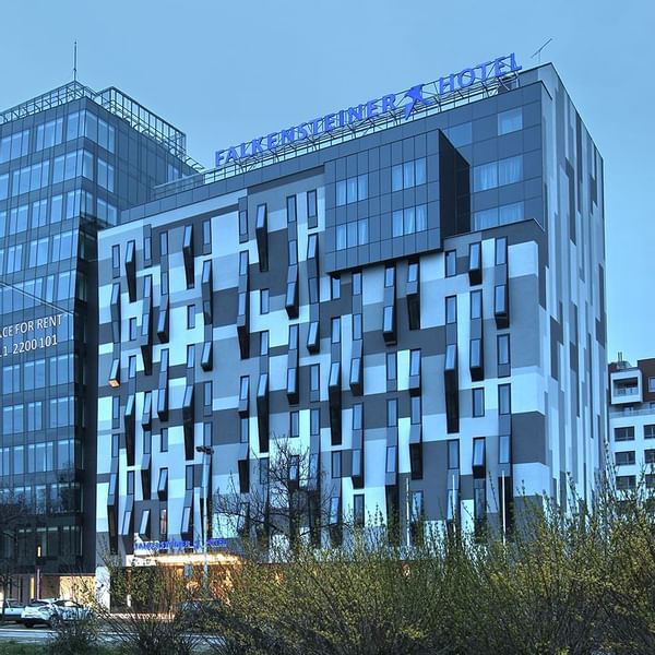 Law-angle exterior view of the Falkensteiner Hotel Belgrade building at evening