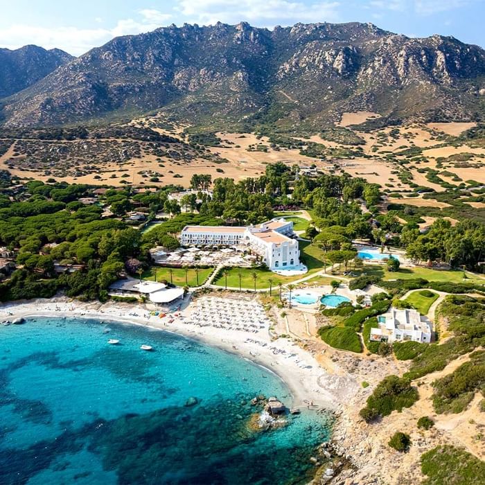 Aerial view of the hotel & pool near the lake and mountain at  Falkensteiner Hotels & Residences