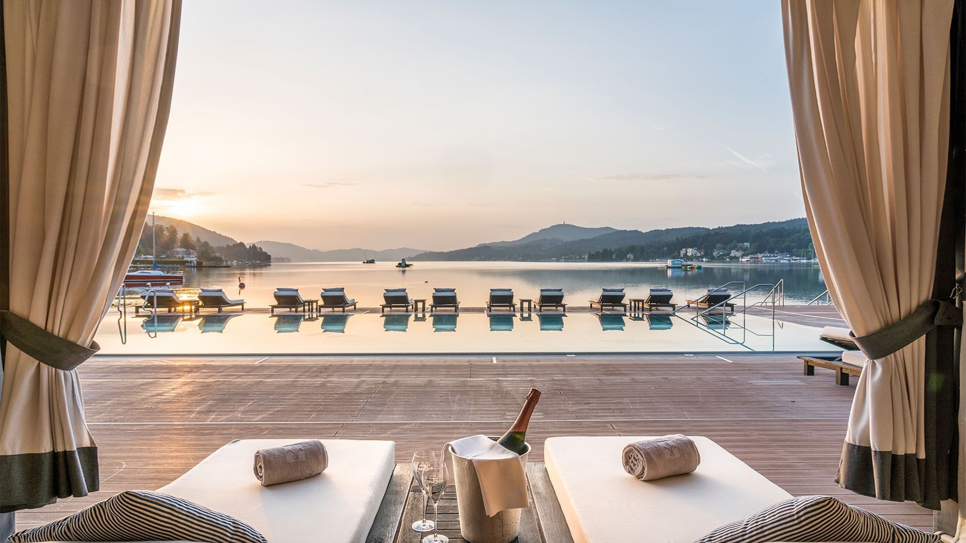 Pool loungers with champagne at Falkensteiner Hotels & Residences